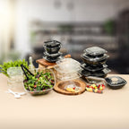 Collection of food containers and a salad on a table with a blurred background