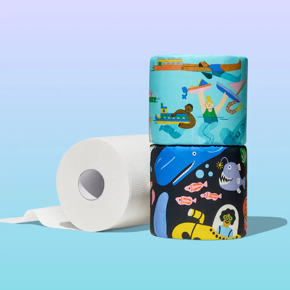 Three rolls of toilet paper with colorful packaging on a light blue background