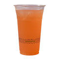 Clear plastic cup with orange beverage and 'greenprint' branding on a white background