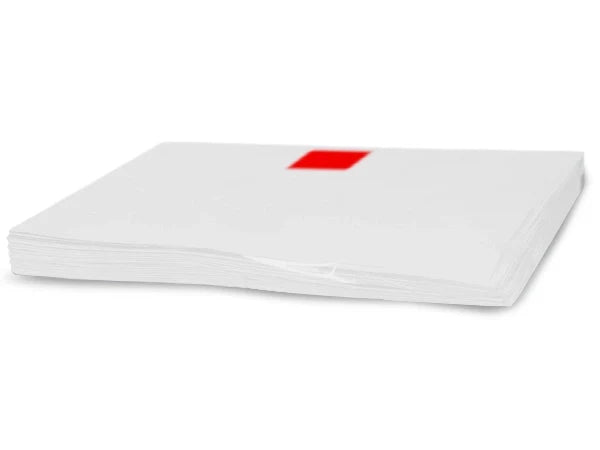 A stack of white paper sheets, photographed on a plain white background.