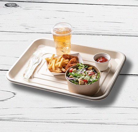 Large carrying tray with food on a wood surface.