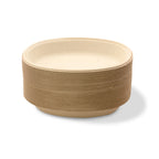Stack of Beige compostable bowls with ribbed texture on a white background