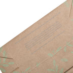 Brown paper with green leaf pattern and text on a white background
