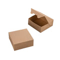 Two plain brown kraft paper boxes on a white background, with one closed box in the foreground and one open box showing the interior in the background.