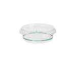 Clear deli bowl with green labels with a clear round lid on a white background