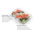 A clear clamshell with clear lid filled with assorted sushi, highlighting the resealable button snaps and bottom closure of the clamshell.