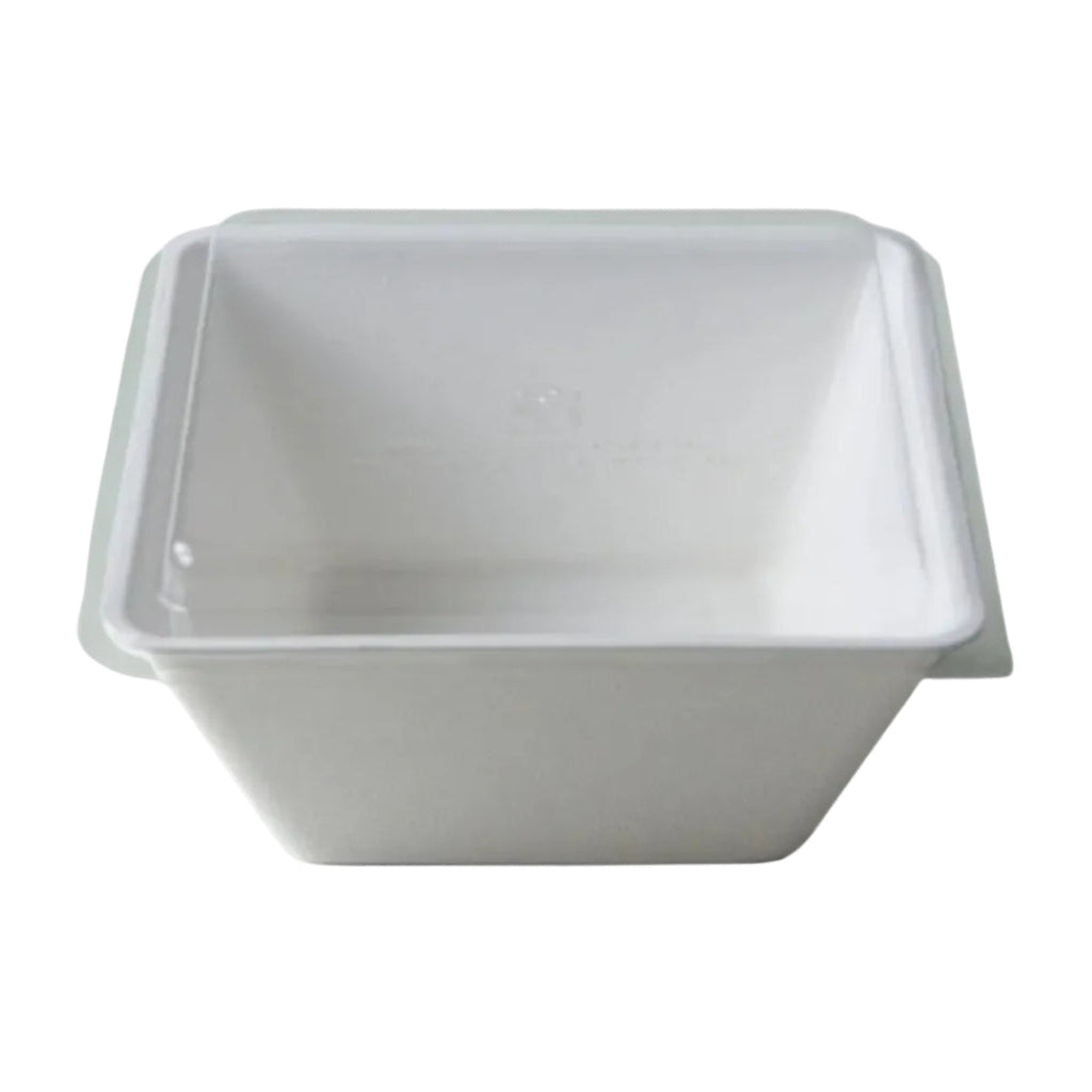 White disposable bowl with a clear lid on a white background