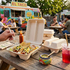 Picture of taco clamshells in a taco truck setting.