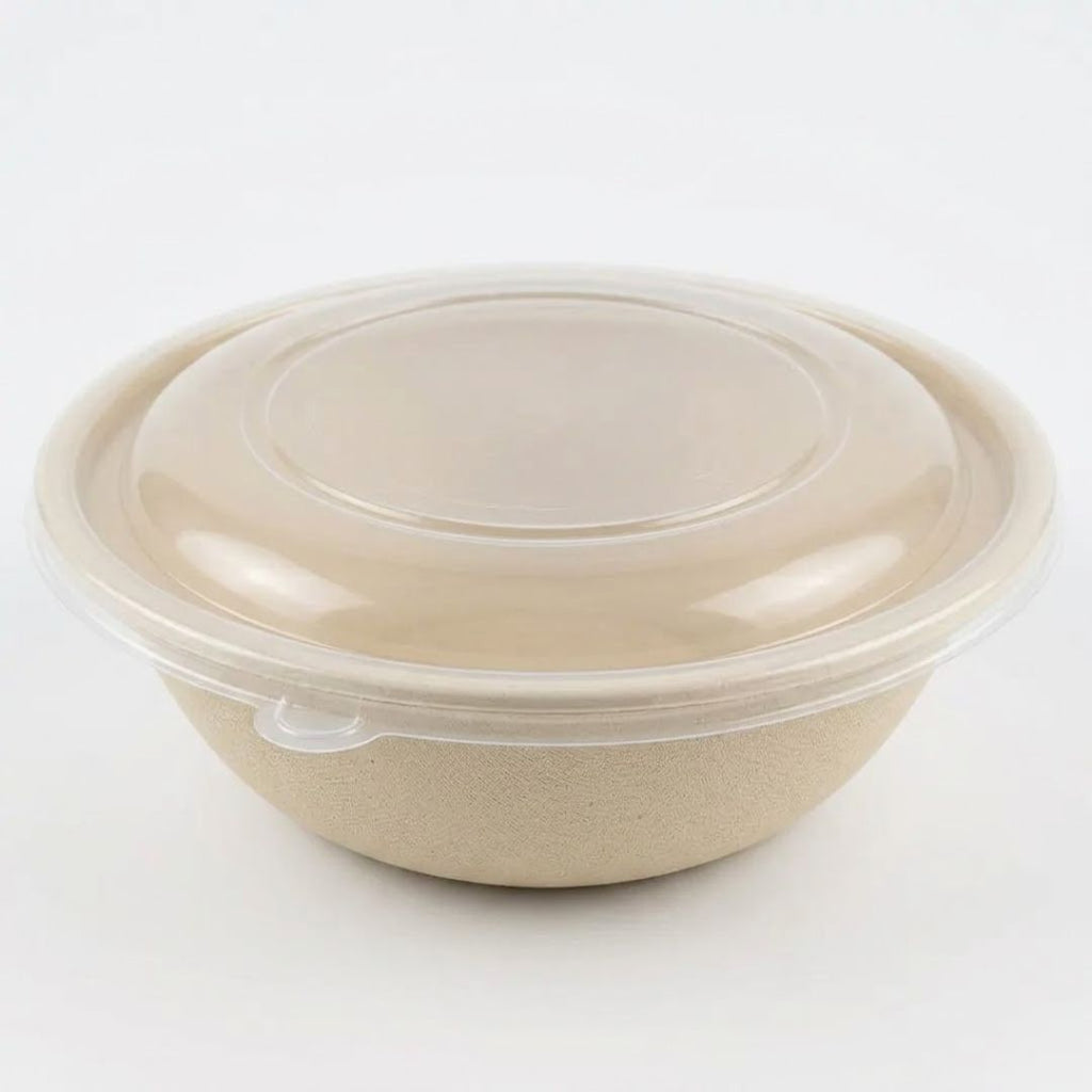 Compostable fiber bowl with a clear lid on a white background