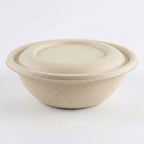 Compostable fiber bowl with fiber lid on a white background
