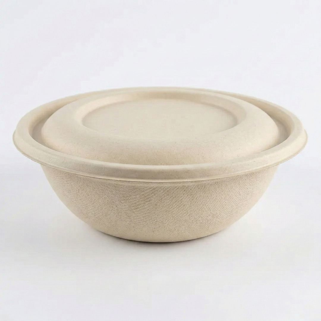 Compostable fiber bowl with fiber lid on a white background