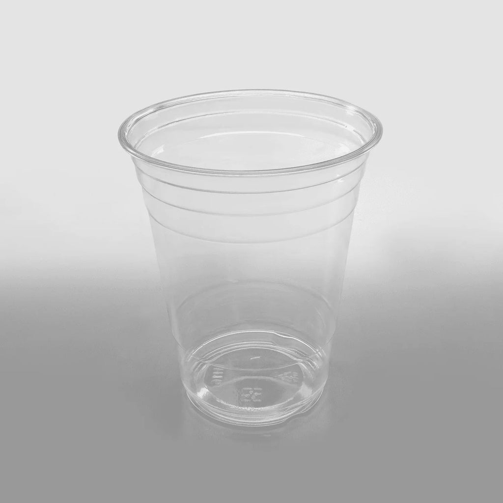 Clear plastic cup on a gray background