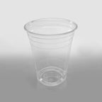 Clear plastic cup on a gray background