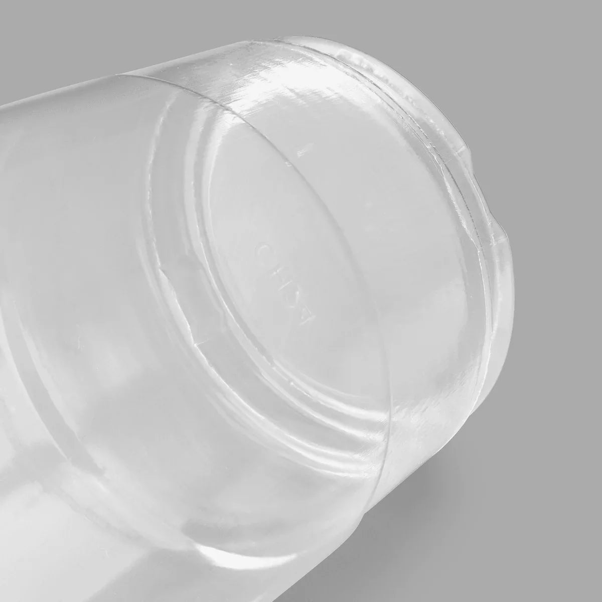 Botton of plastic cup on a gray background