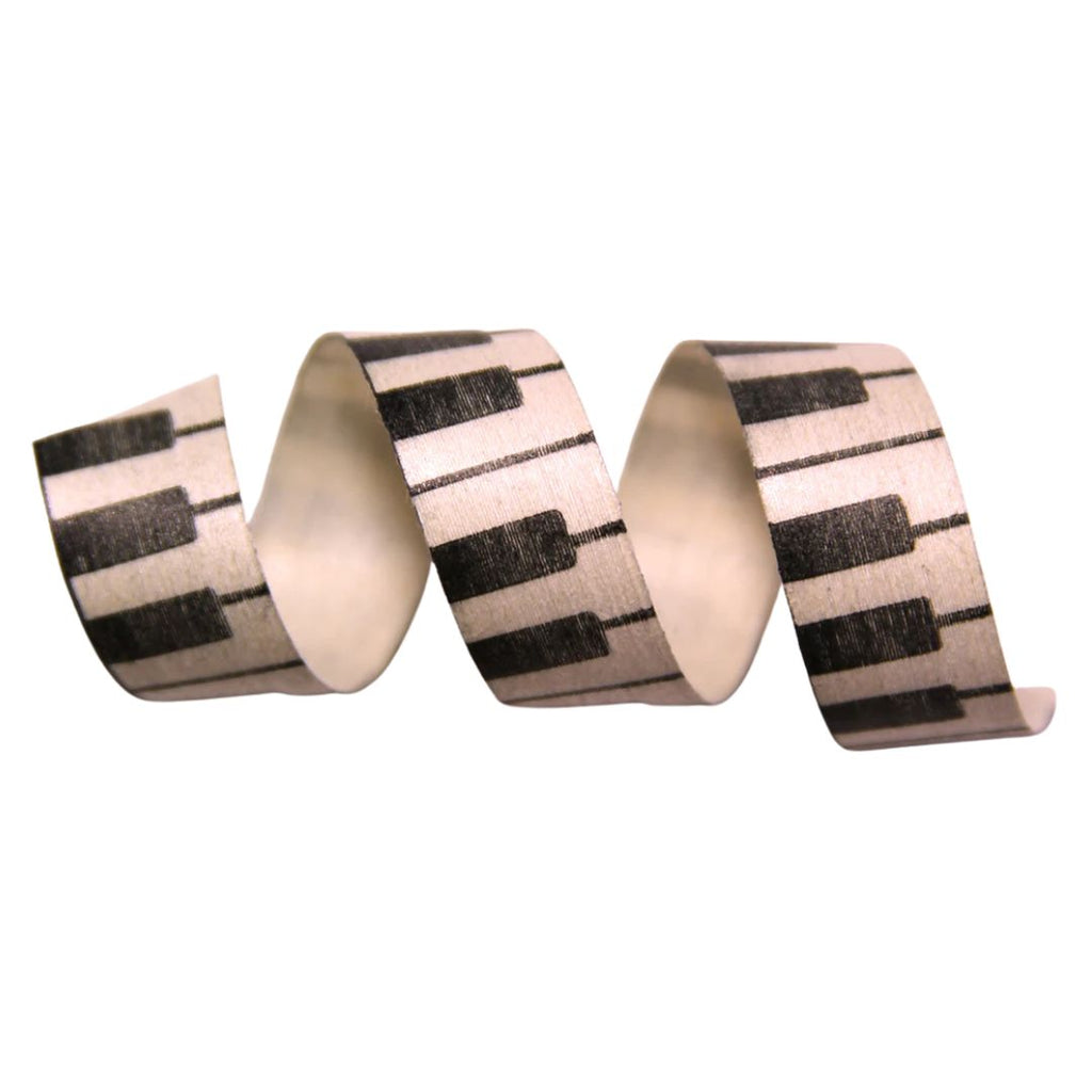 Decorative ribbon with piano key pattern on a white background