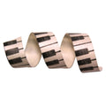 Decorative ribbon with piano key pattern on a white background