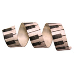 Decorative ribbon with piano key pattern on a white background