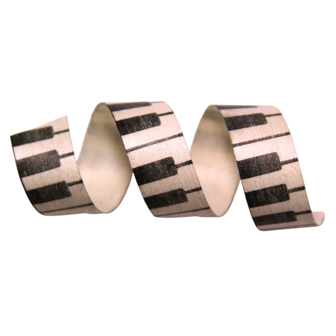 Decorative ribbon with piano key pattern on a white background