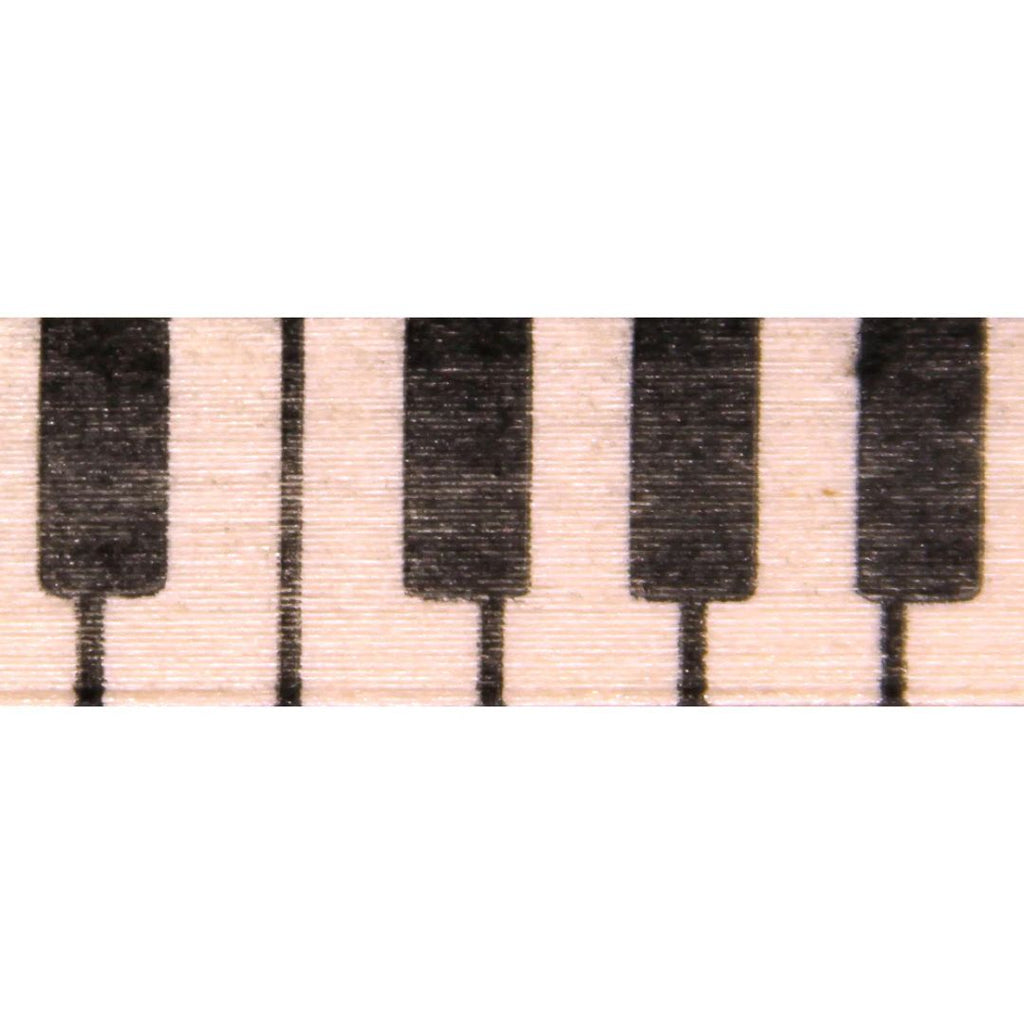Close-up of piano key pattern on a beige background