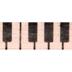 Close-up of piano key pattern on a beige background