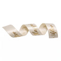 Cream ribbon with gold text on a white background