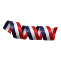 Twisted ribbon in red, white, and blue on a white background