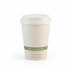 White compostable coffee cup with a green label on a white background