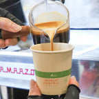 Coffee being poured into a World Centric paper cup.