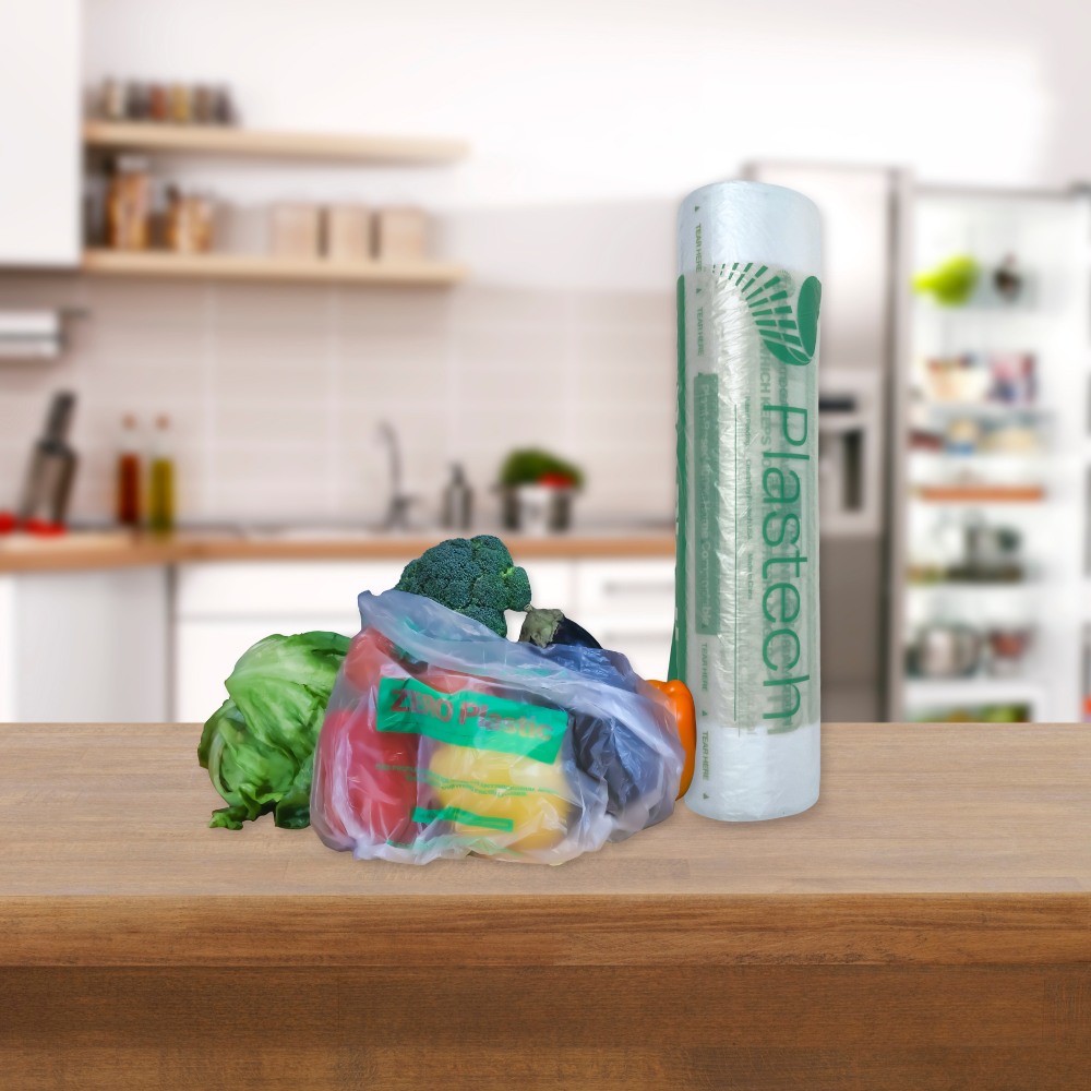 Plastechm product on a kitchen counter with vegetables and a bag of groceries.