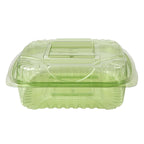 Compostable green plastic container with a lid on a white background
