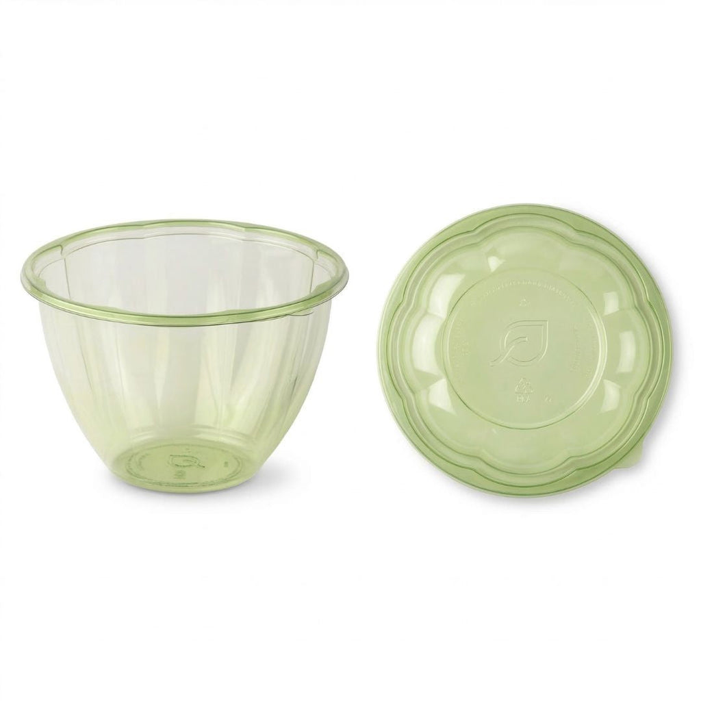 Green tinted salad bowl with a lid on a white background