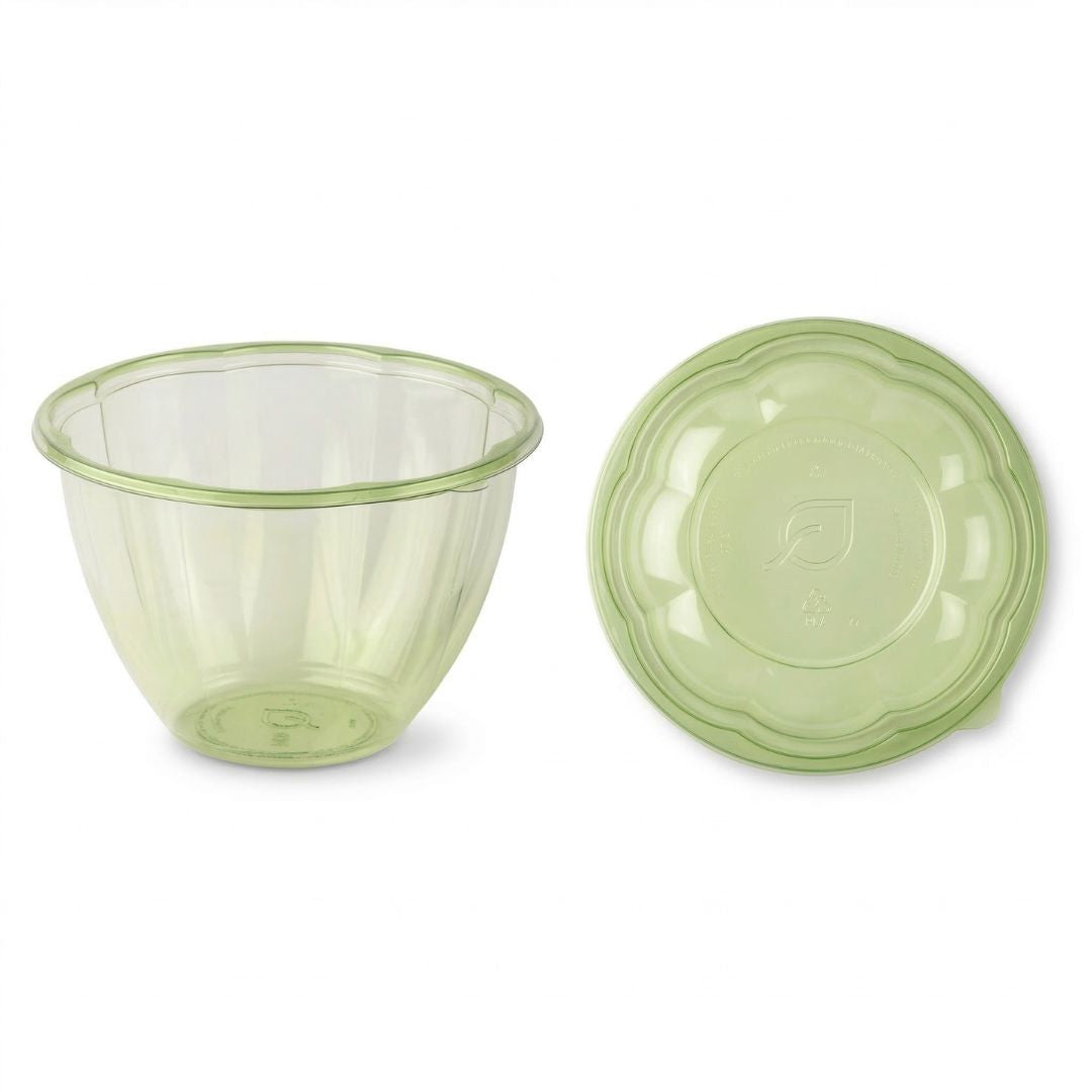 Green tinted salad bowl with a lid on a white background