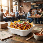 Compostable bowl of nachos with a casual dining setting in the background