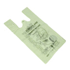 Green compostable bin liner with text on a white background