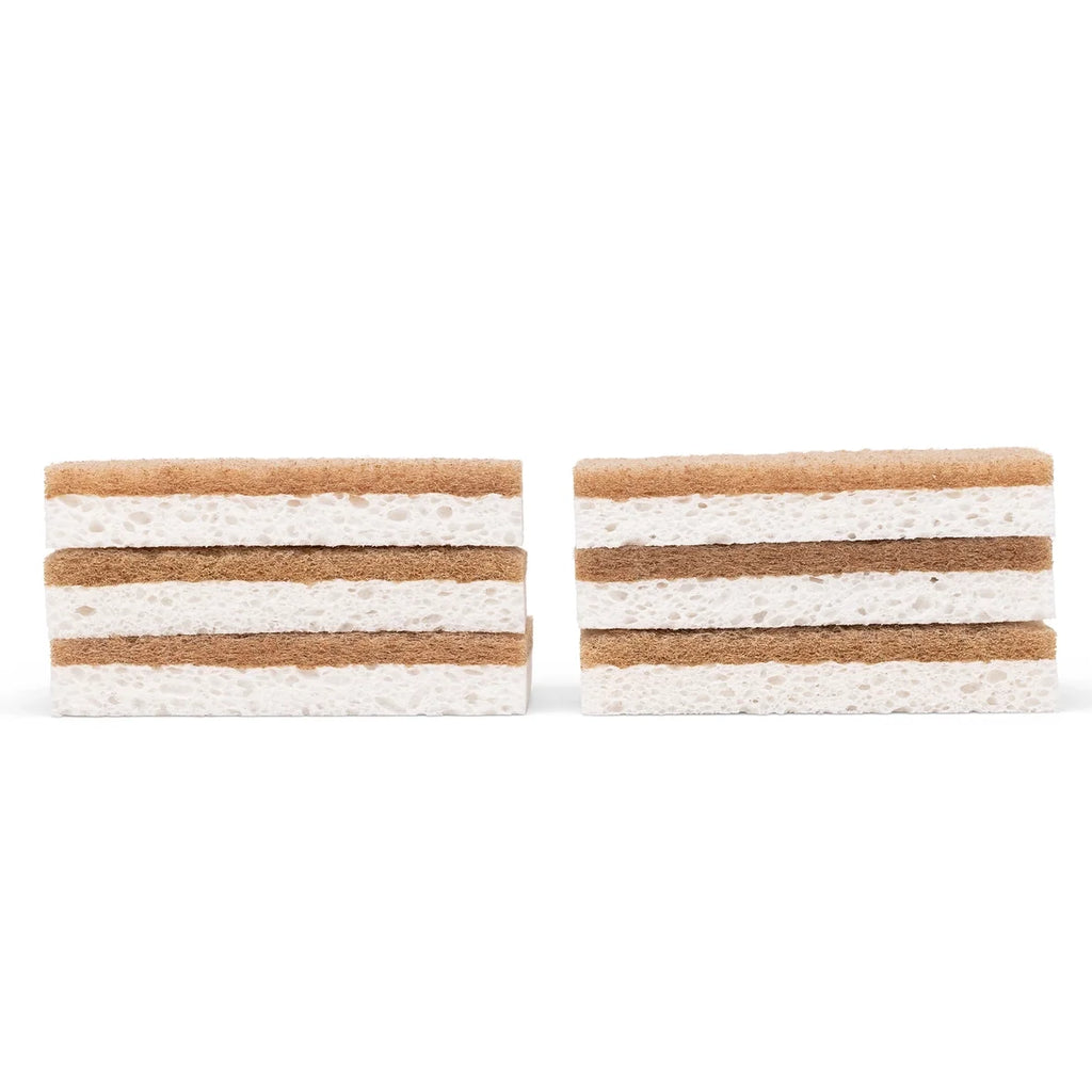 Scrubbing sponges with brown and white side stacked on a white background