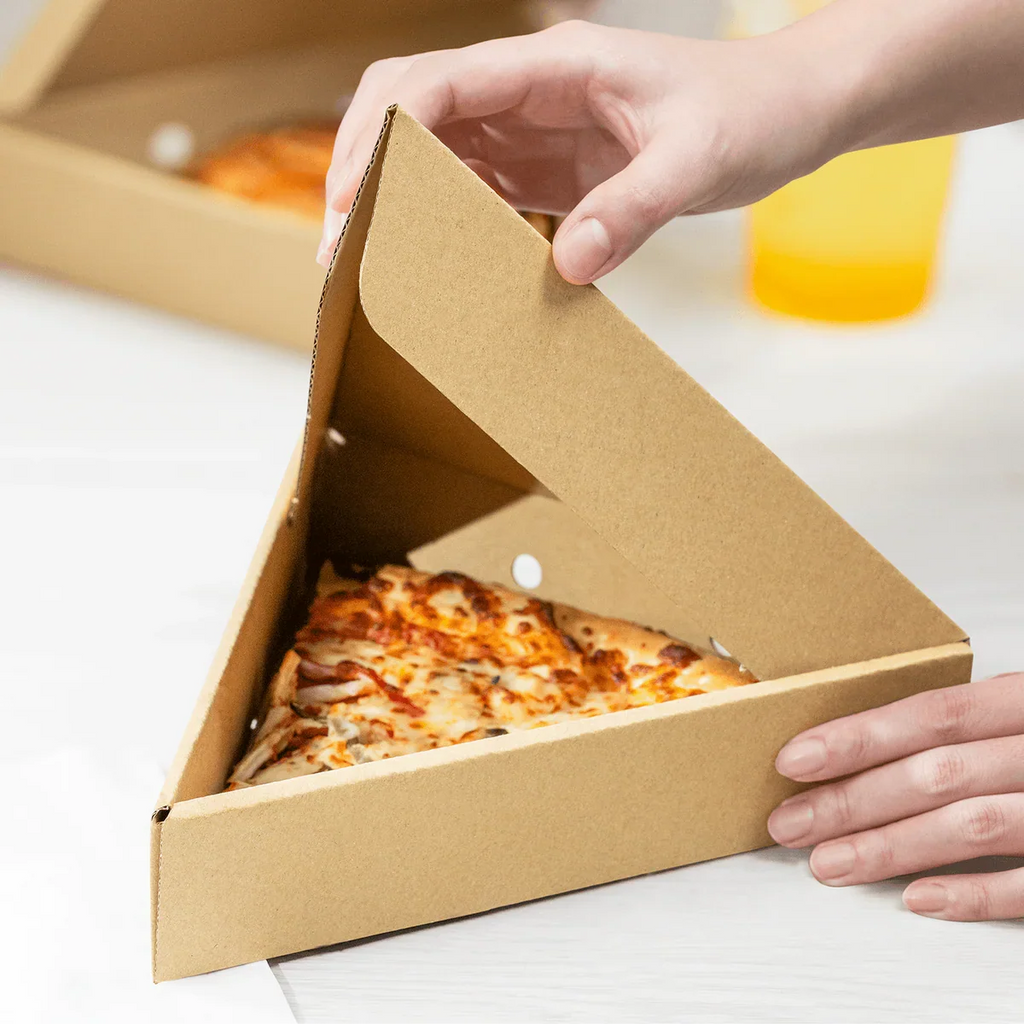 Slice of pizza in a triangular pizza box.