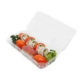 Assorted sushi in a clear compostable plastic container on a white background