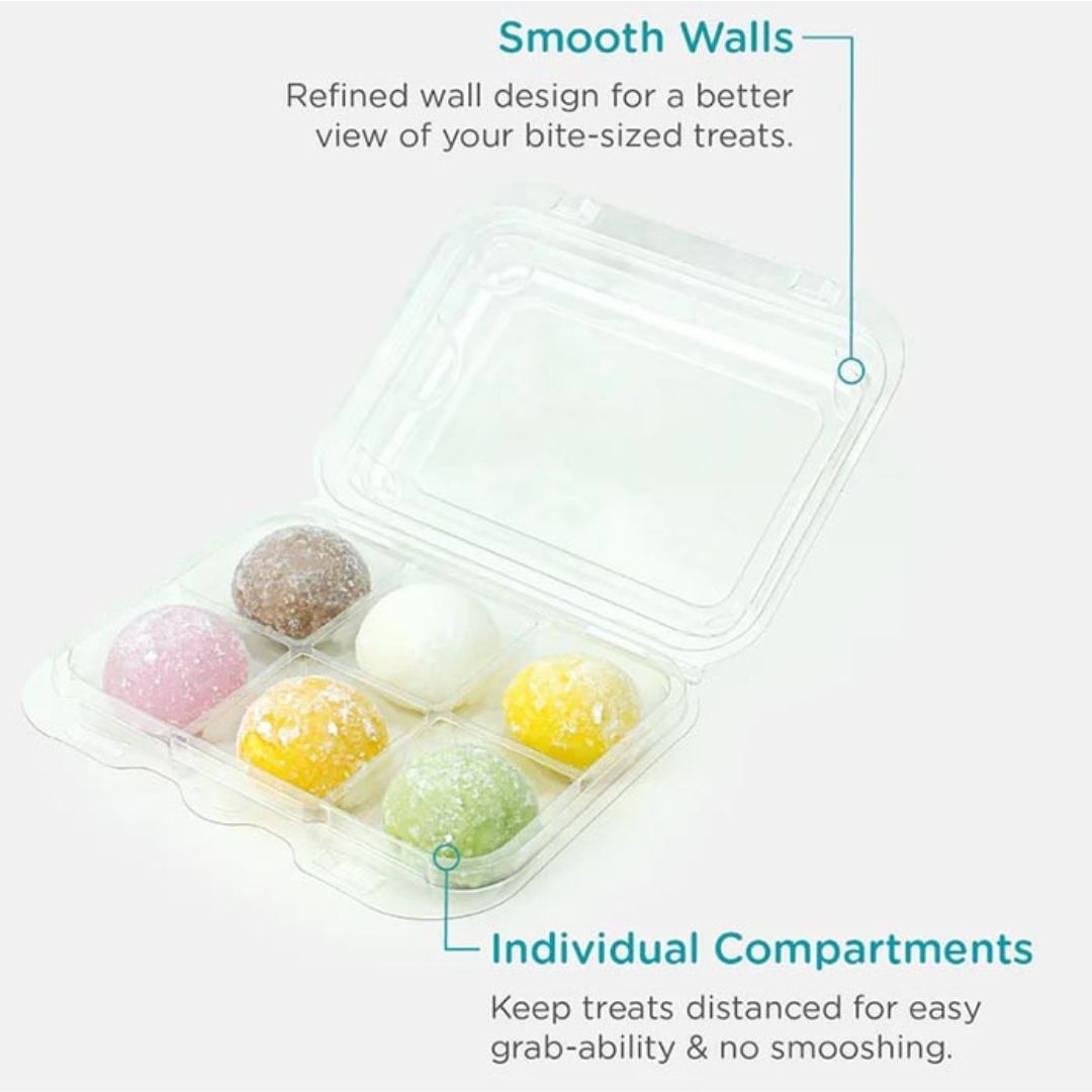 Clear container with individually compartmented bite-sized treats on a white background