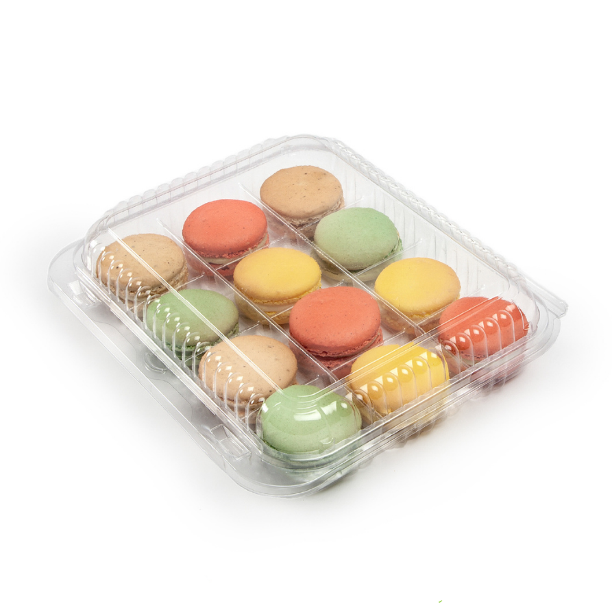 Clear compostable plastic treat container with colorful macarons on a white background