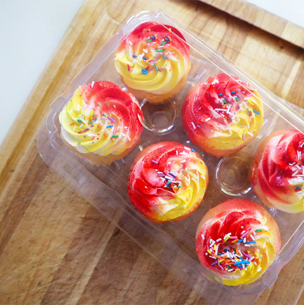 6-Pack Hinged Cupcake Container containing frosted cupcakes.