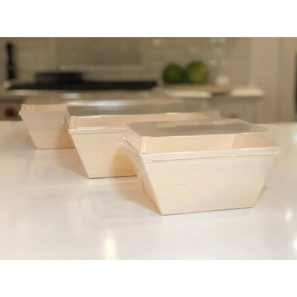 Set of wooden food containers on a kitchen counter