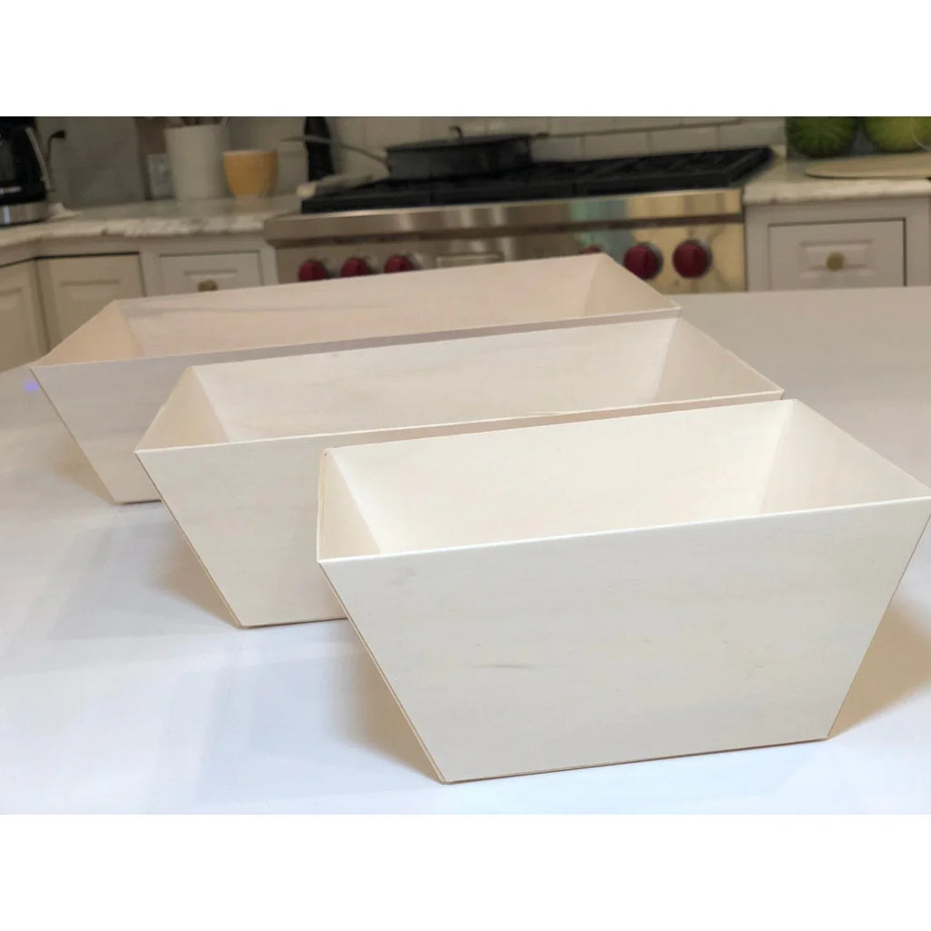 Set of three beige square trays on a kitchen counter