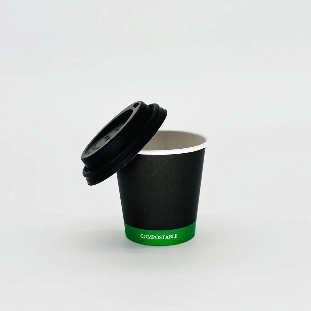Black compostable cup with a lid on a white background