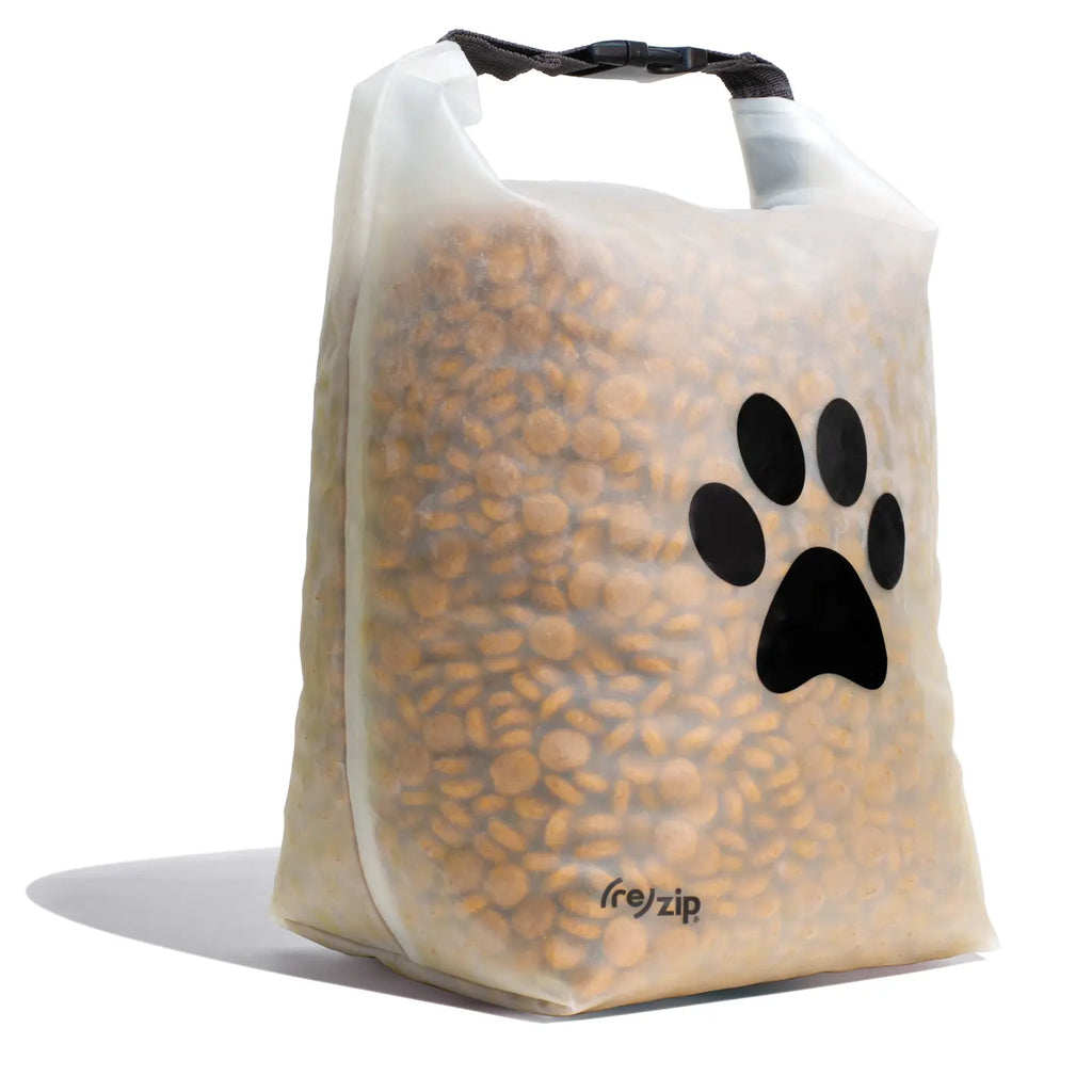 Clear bag of pet food with a black paw print and 're:zip' branding on a white background