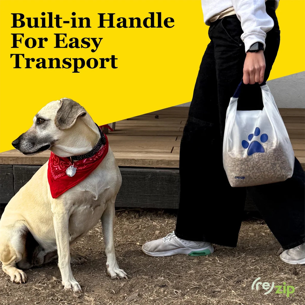 Dog wearing a red bandana sitting next to a person holding a bag with a paw print design, on a yellow background.