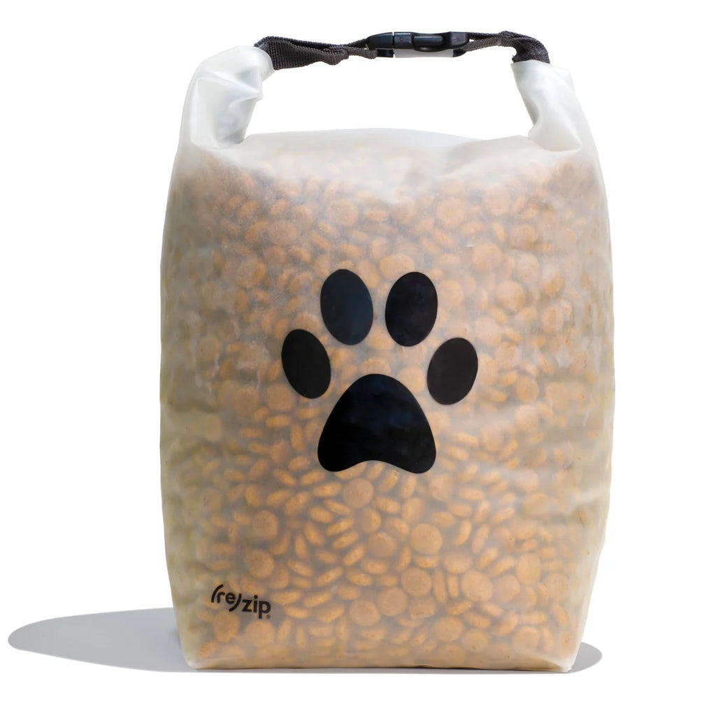 Dog food bag with paw print design and 'freepak' branding on a white background