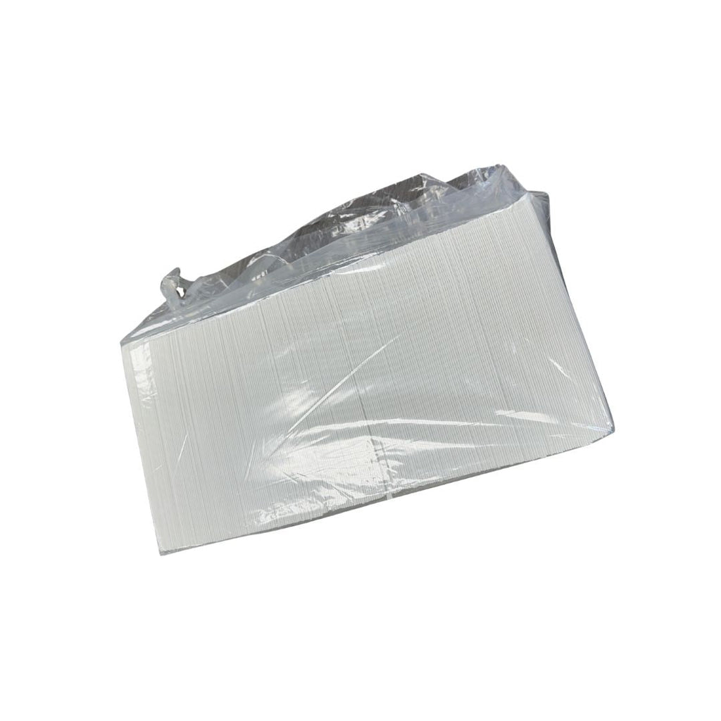 Clear plastic bag containing folded napkins on a white background