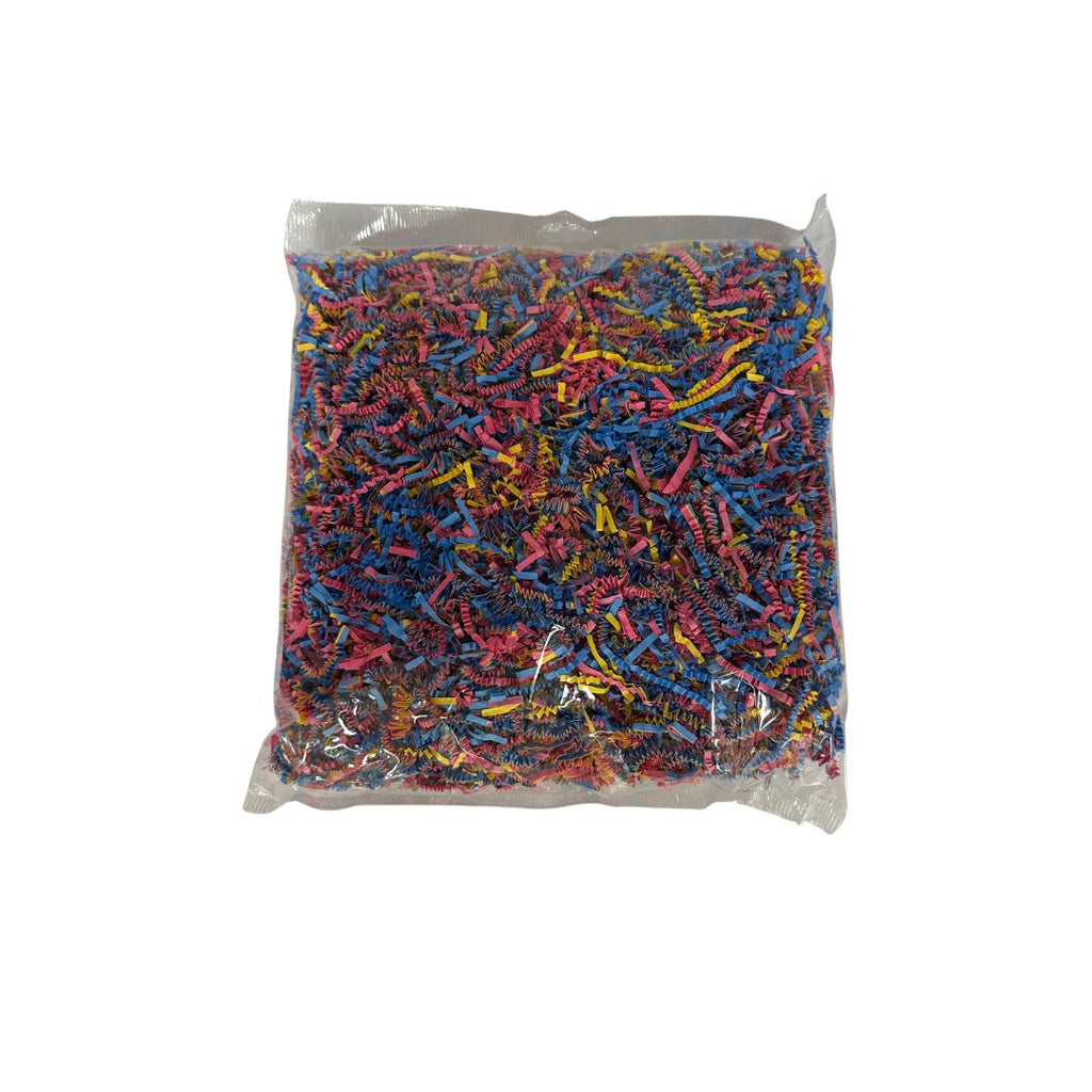 A clear bag filled with shredded multicolor paper craft scraps, photographed against a plain white background.