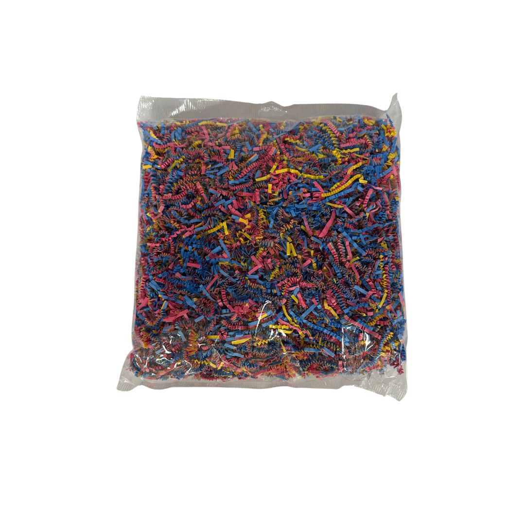 A clear bag filled with shredded multicolor paper craft scraps, photographed against a plain white background.