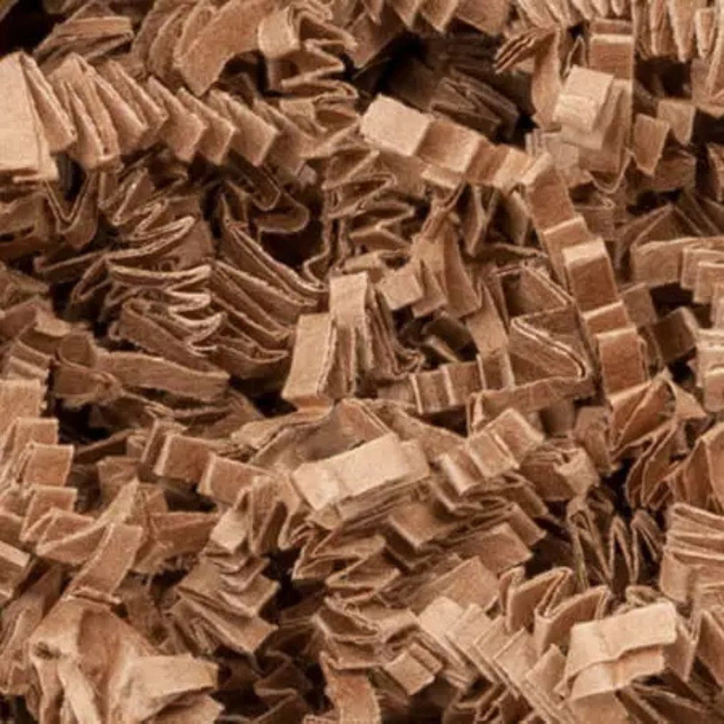 A close-up view of shredded brown kraft paper filler or craft shreds filling the entire frame.